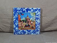 Front cover of psychedelic blue bordered album artwork.