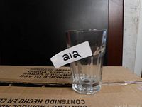 Single clear 9 oz Hi Ball glass with faceted Gibraltar design shown on a box.