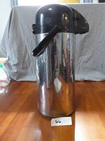 Front view of Bunn thermos beverage dispenser with pump