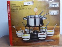 Photo of boxed 24 piece 3-in-1 fondue set by Home Presence showing the set contents and item use for chocolate, cheese, and meat fondue with gel fuel holder.