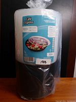 Picture of one full package of Cafe Express round take out containers and lids wrapped in plastic. Package shows product label with item count and size.