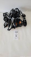 Lot of 10 HDMI cables bundled together on white background with unique lot identifier tag visible