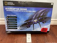 Box front showing National Geographic Quadcopter Drone with features listed and suitable age 14+