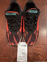 Top down front view of both Jordan Runners shoes, showing black laces and orange red gradient as well as 'Jordan Runners' teal logo on the tongue.