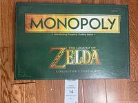 Closed box of Monopoly The Legend of Zelda Collector's Edition with logos and age recommendation.