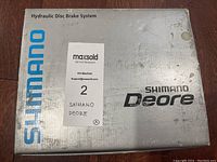 Photo of the Shimano branded silver box labeled 'Hydraulic Disc Brake System' for Shimano Deore.