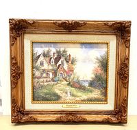 Framed signed canvas transfer artwork of a manor titled 'Bearyhill Manor', showing detailed scenery, signed plaque, and ornate wood frame.