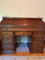 Front view of roll-top desk with tambour closed