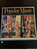 Front of the box displaying colorful artwork with the title 'Popular Music That Will Live Forever' and RCA Records branding.