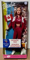 Full view of Barbie doll in unopened box showing Canadian flag, athletic outfit, and necklace.