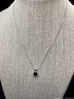 Pendant displayed on a bust showing chain length and pendant size.