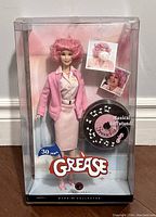Full view of Barbie Grease 30th Anniversary Frenchie doll in original sealed box with musical doll stand.