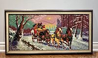 Front view of the large framed needlepoint showing the full winter scene with horse-drawn stagecoach in a snowy forest.