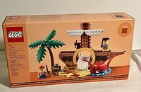 Front of the sealed Lego box showing 168 pieces, suitable for ages 7+, with the pirate ship playground building assembled on the front.