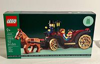 Front view of Lego Wintertime Carriage Ride box, sealed, featuring a assembled horse-drawn carriage with two minifigures and the driver visible on the package front illustration