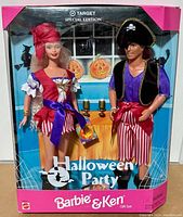 Front view of the factory sealed Halloween Party Barbie and Ken gift set in original packaging showing the dolls dressed in pirate costumes against a Halloween-themed background.