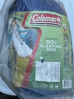 Photo of Coleman Land Rover 50°F Sleeping Bag in original packaging showing features and product details.
