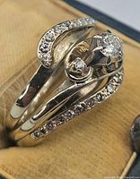 Three rings stacked in a velvet box showing full set