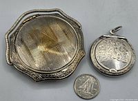 Two antique silver containers side by side with a Canadian 10 cent coin for scale.