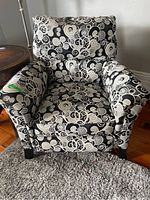 Front view showing overall shape, upholstery pattern and wood legs