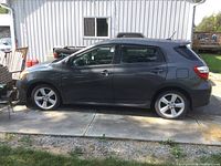 Side profile of vehicle showing overall exterior condition