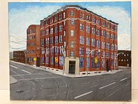 Front view of the signed oil on canvas painting featuring a red brick building at a city intersection with traffic lights.