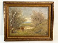 Frontal view of the framed old landscape painting showing the woman, cows, trees and fields.