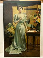 Full view of large oil painting depicting a woman in a pale green dress standing near a table and floral display.