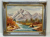 Full view of the framed landscape oil painting with autumn river and mountain scenery showing signature and frame details.