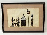 Full view of framed African mother of pearl shell artwork showing figures, hut, and tree