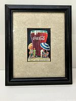 Frontal view of the framed Coca Cola advertising print with entire frame and image visible.