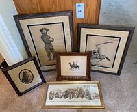 Five framed wall art pieces arranged on floor including western man portrait, bucking horse and rider, horse head circle, small horse riders, and long horizontal whimsical cartoon art.