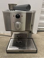 Front view of Breville Cafe Roma espresso machine showing control panel, indicator lights, and portafilter on top.