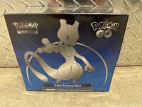 Front view of the sealed Pokemon Go Elite Trainer Box with Mewtwo artwork on box.