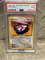 Image of 1997 Japanese Team Rocket Porygon Pokémon card in PSA graded slab.
