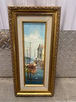 Full view of framed oil painting featuring harbor scene with boats and dock.