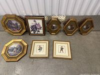 All framed artworks arranged on floor showing the variety and condition of the collection.