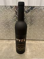 Black bottle-shaped case with gold lettering 1924 Limited Edition Cabernet Sauvignon mock bottle.