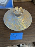 Closed top view of the ceramic candy dish lid showing detailed 22k gold crackled pattern and unique gold handle.