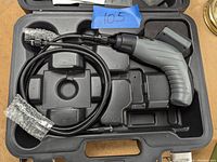Handheld video inspection snake inside molded plastic carrying case with foam cutouts, camera probe ends wrapped in bubble wrap