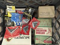 Photo showing assorted Stanley steel corner braces and other fasteners, some still in package