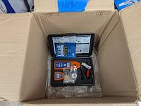 H-Tech circuit detector kit in open box inside a cardboard box.