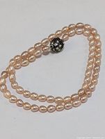 Full view of the 16-inch natural fresh water pearl necklace with a CZ ball clasp, showcasing the pearl strand and the clasp detail.