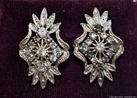 Front view of sterling silver earrings showing CZ stones and detailed design