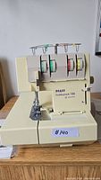 PFAFF hobbylock 788 serger front view showing four tension dials and spool holders