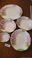 Five piece Royal Albert Blossom Time pattern porcelain china serving set displayed on wooden table