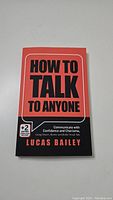 Front cover of the book 'How to Talk to Anyone' by Lucas Bailey showing title, subtitle, and design details.