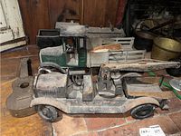 Front-angle view of crane truck in foreground with two other trucks behind