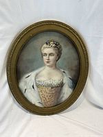 Full frontal view of oval pastel portrait in gilt-wood frame