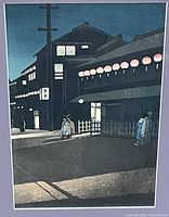 Overall view of print under glass showing street scene